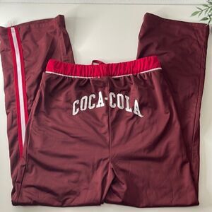Coca-Cola silky soft sweatpants. Size Small. Drawstring waist. Pockets at waist.